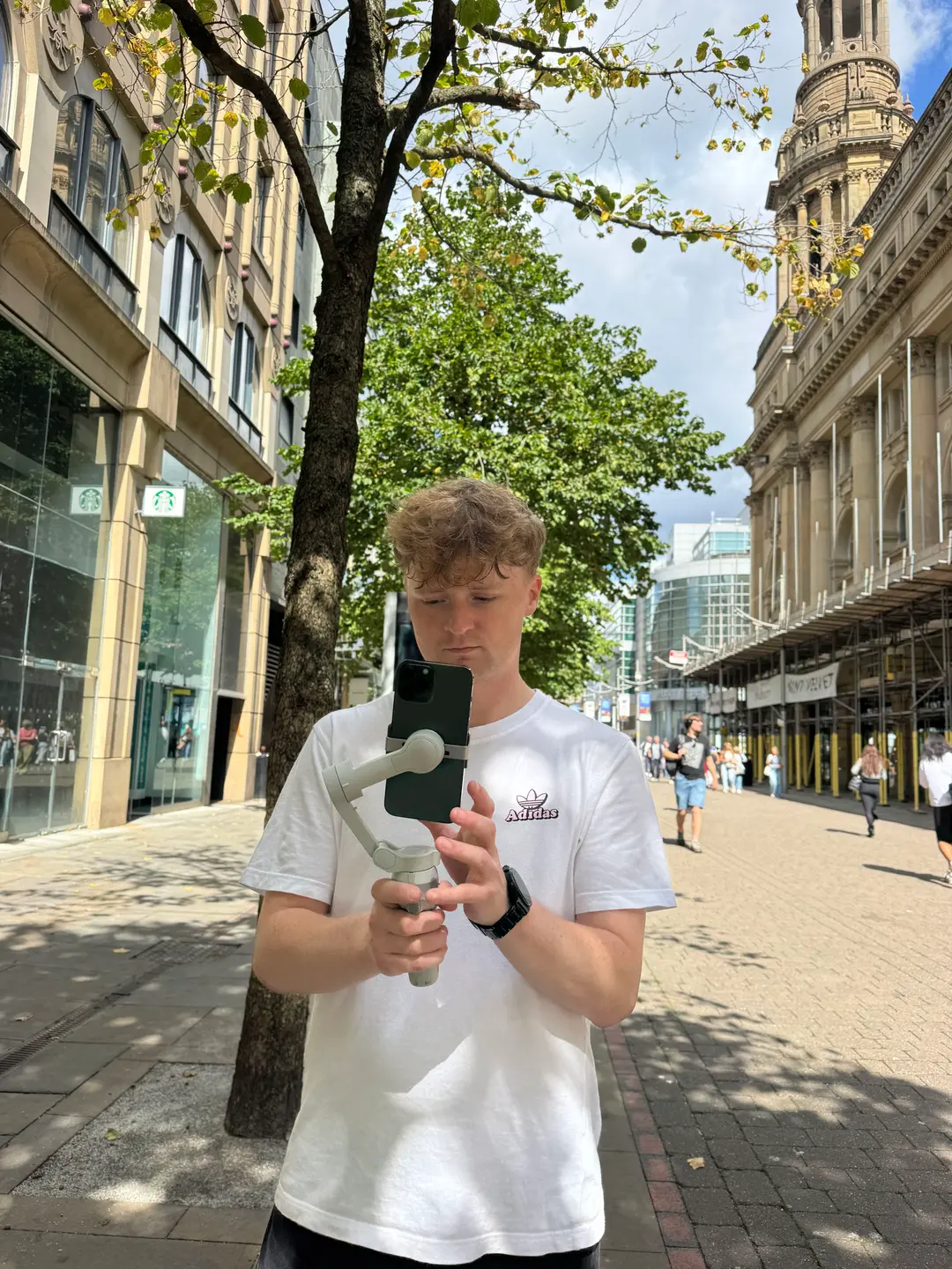 A Super Reel Travel creator filming a scene on their phone